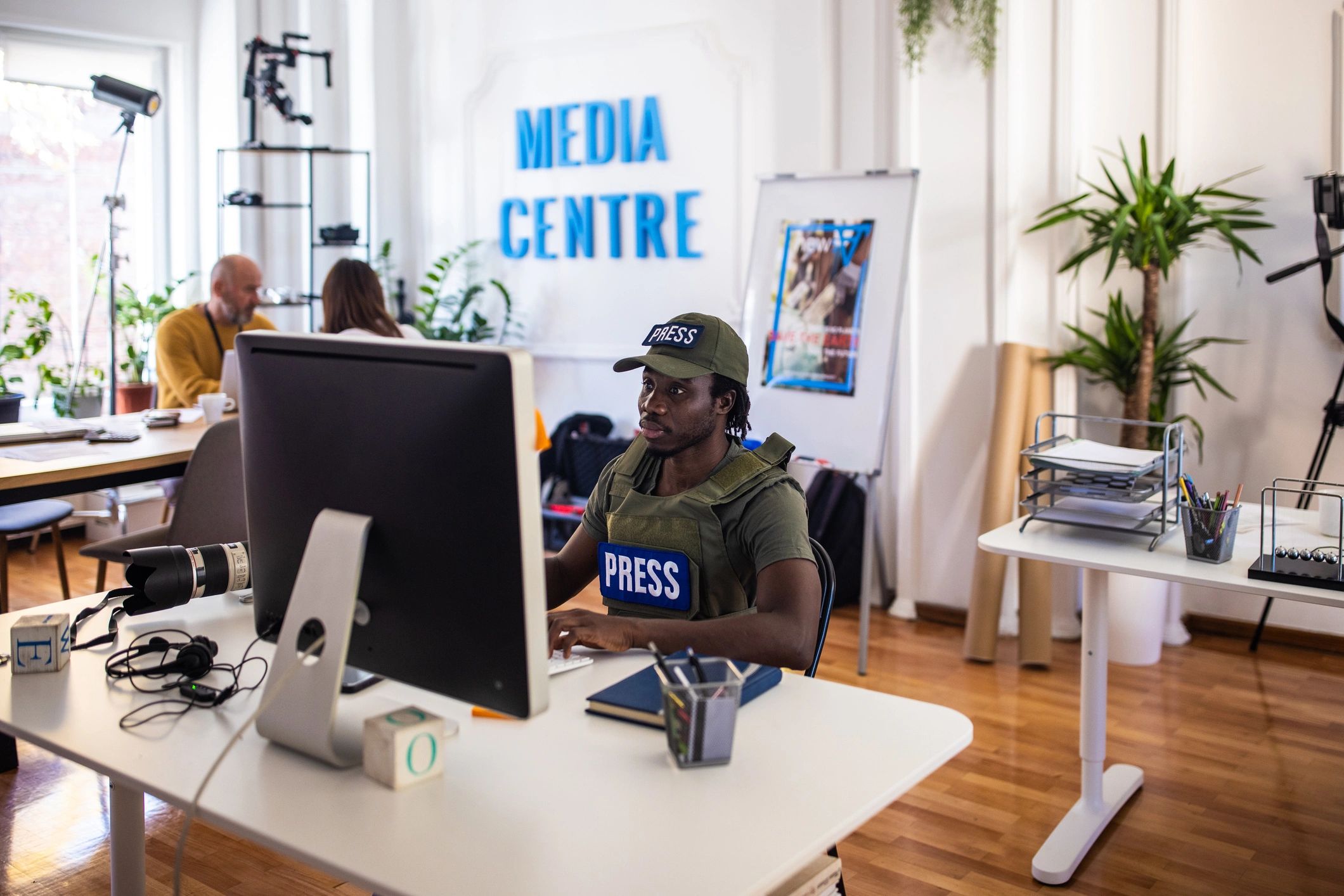 Journalists collaborating in a newsroom