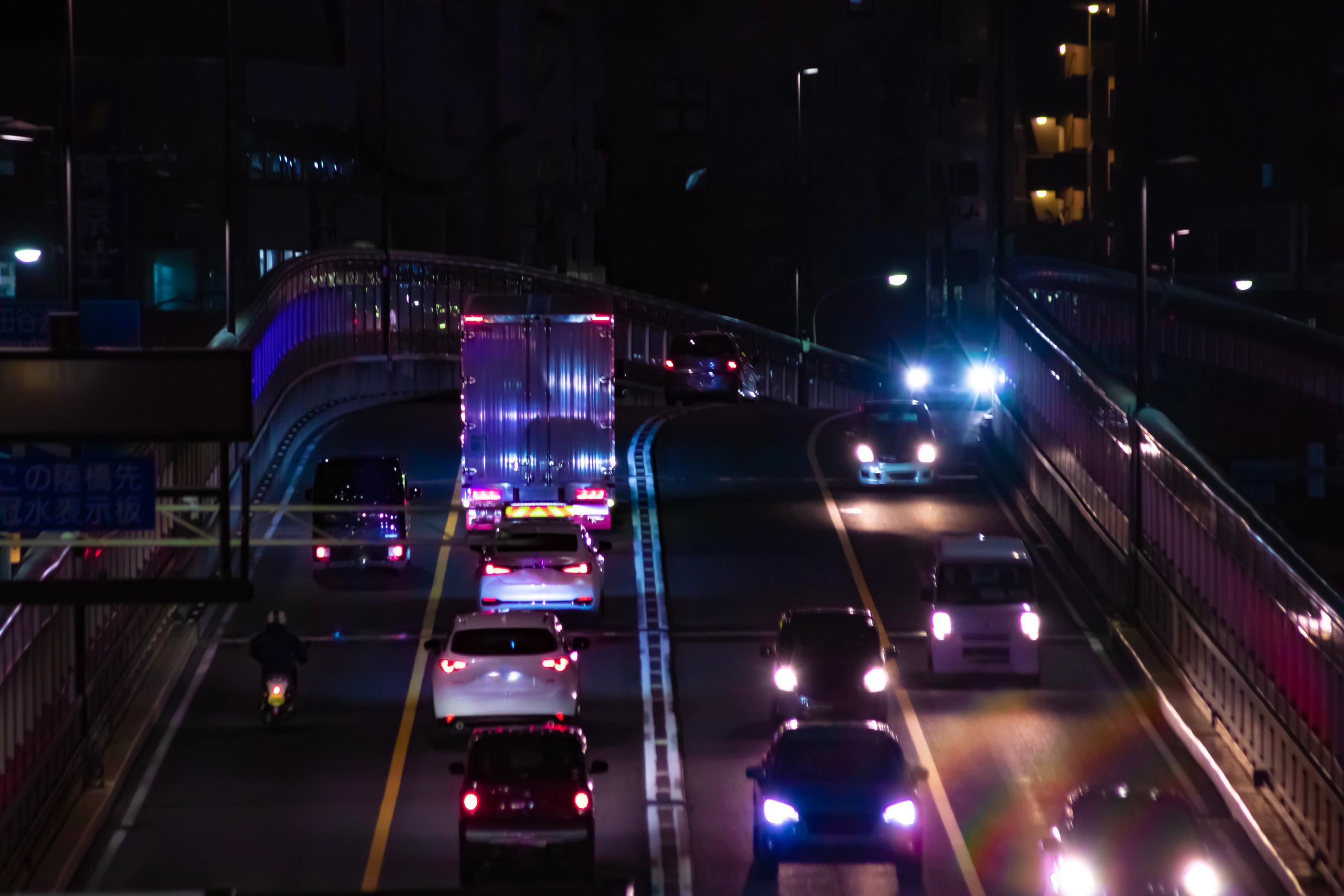 Night city traffic and police response visual for crime coverage