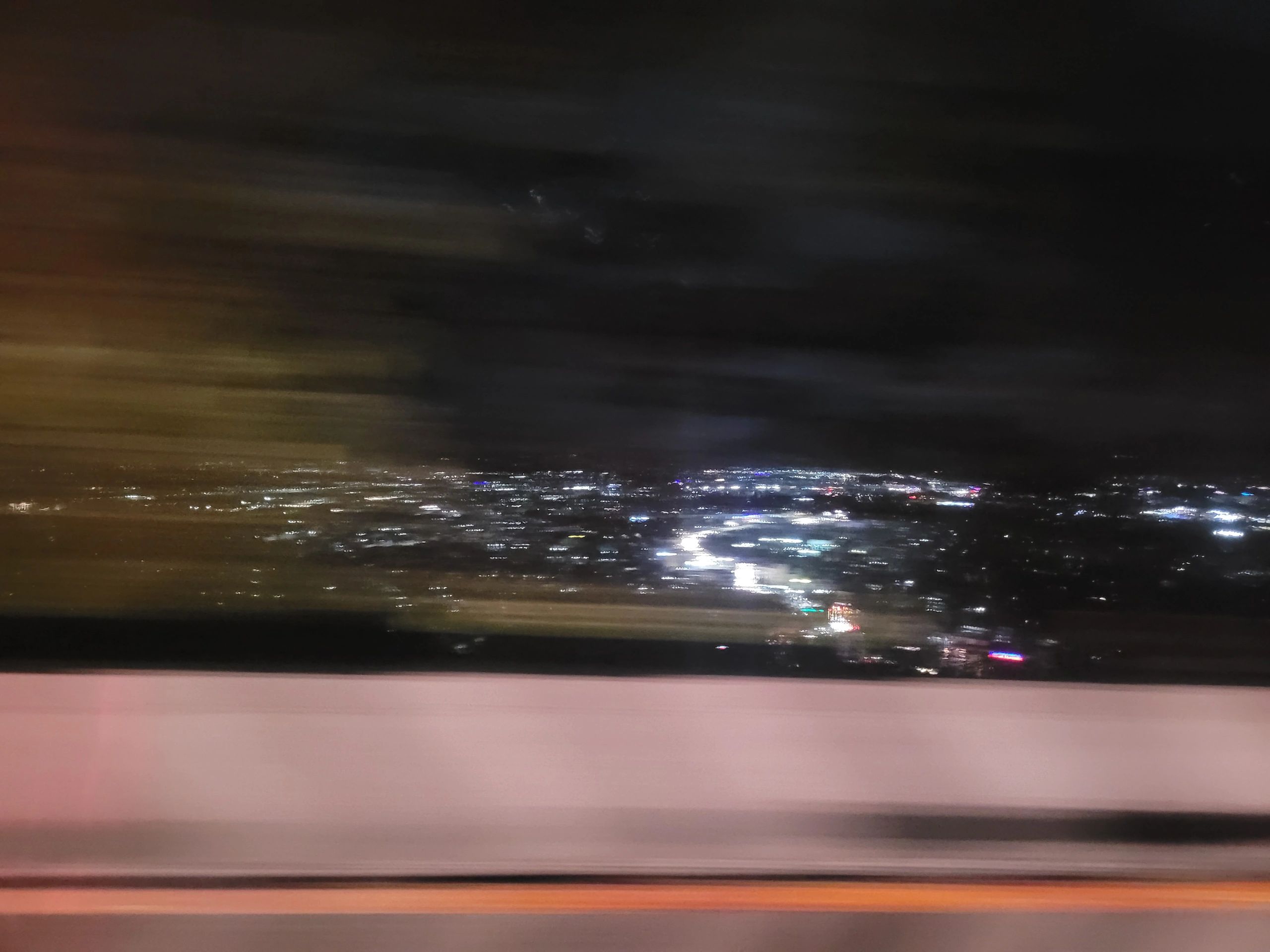 City street lights and urban traffic scene at night